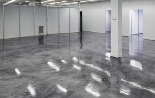 This image shows an commercial building floor with a gray epoxy floor.