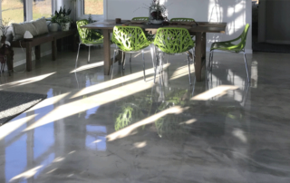 This image shows a dining room floor with a gray epoxy floor.
