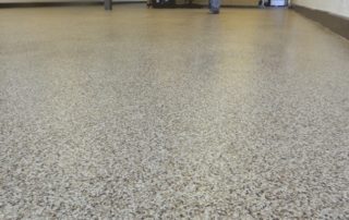 This image shows a floor with a flake epoxy installed in it.