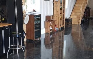 This image shows a garage with a gray epoxy floor.