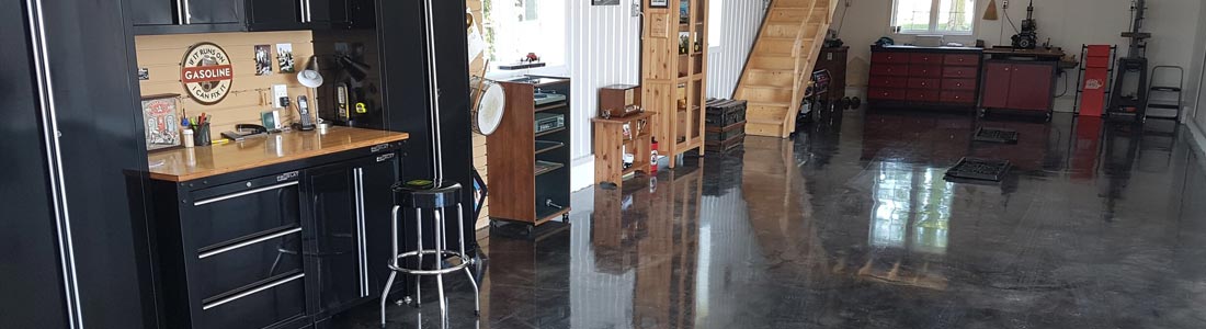 This image shows a garage with a gray epoxy floor.