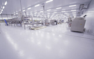 This image shows a white epoxy floor in an industrial plant.