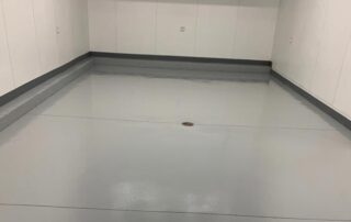 This image shows an Industrial building floor with a gray epoxy floor.