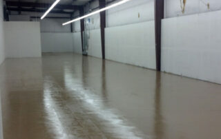 This image shows an Industrial building with a brown epoxy floor.