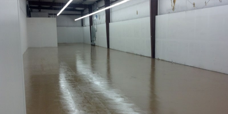 This image shows an Industrial building with a brown epoxy floor.