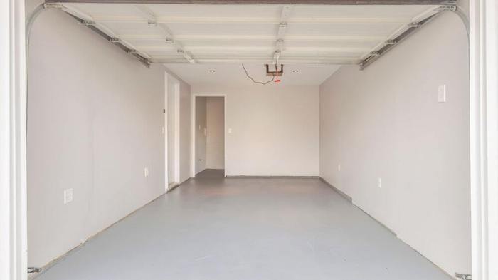 This image shows a garage with a gray epoxy floor.