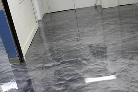 This image shows an Industrial building with a metallic epoxy floor.
