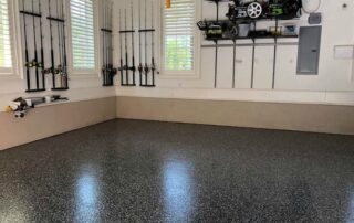 This image shows a garage with flake epoxy flooring