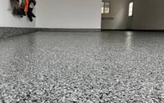 This image shows an epoxy flake floor of a garage.