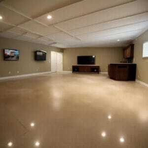 basement epoxy flooring This image shows a basement that has a brown epoxy floor.