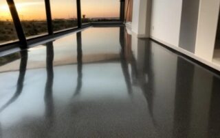 This image shows a floor that was painted with black epoxy.